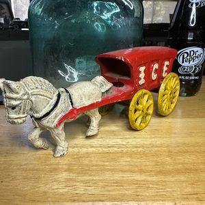 Vintage cast iron ice trailer and horse.